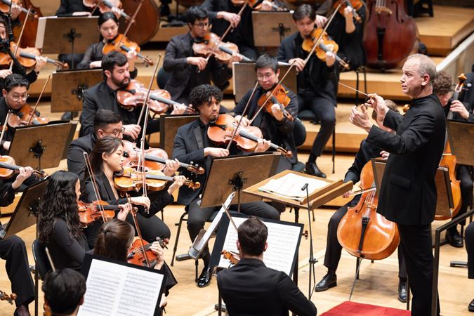 strings playing on stage